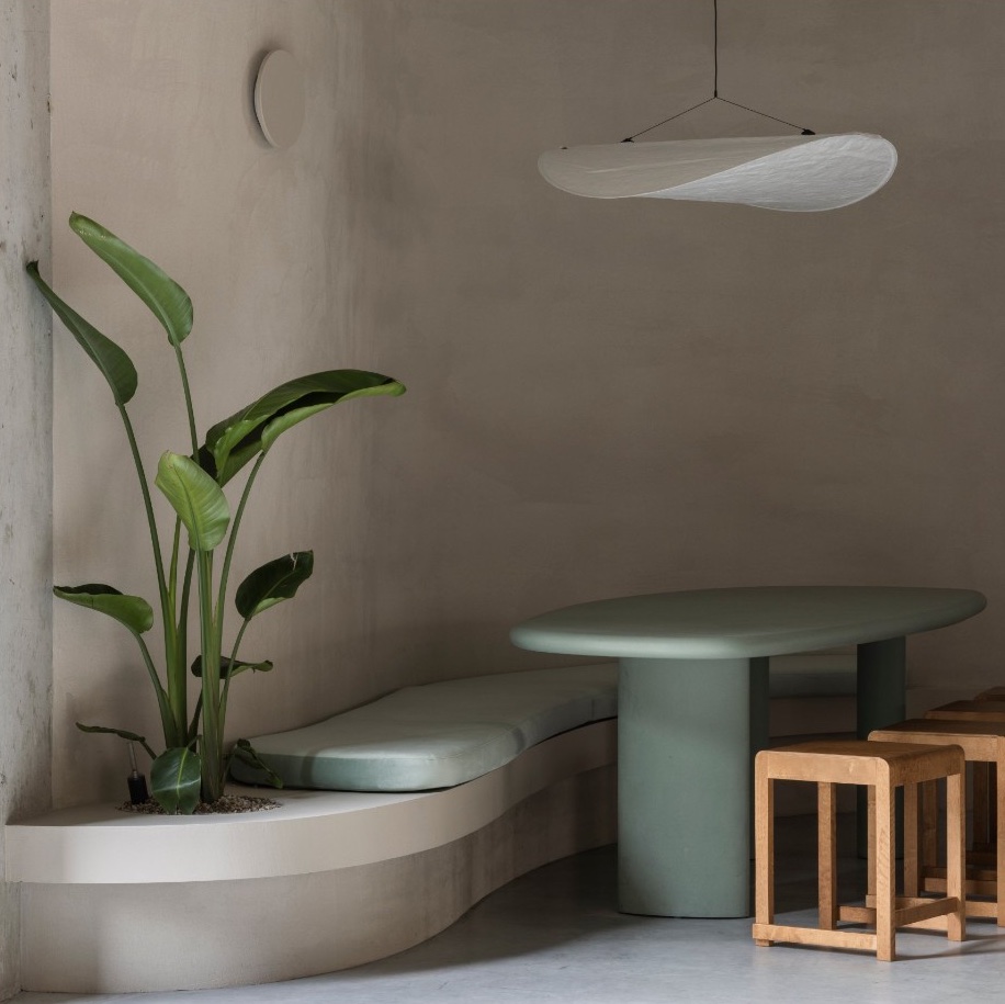 seven interior, green bench and table